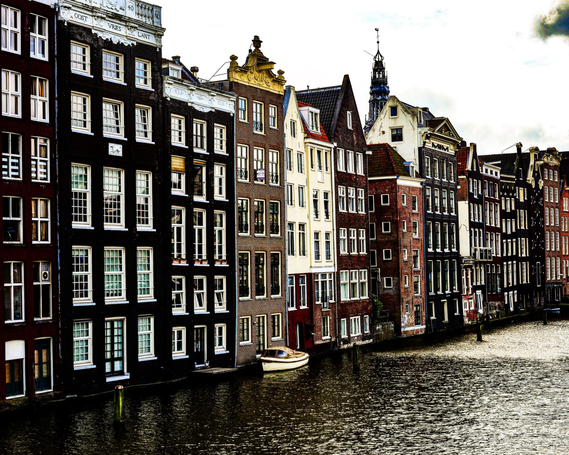 Leaning canal houses on the Damrak, Amsterdam, Netherlands