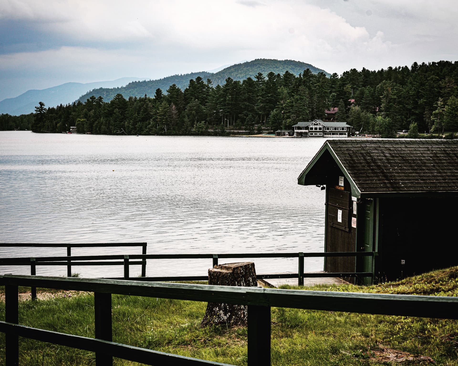 Dock and mountains across the water, Mirror Lake, Adirondacks