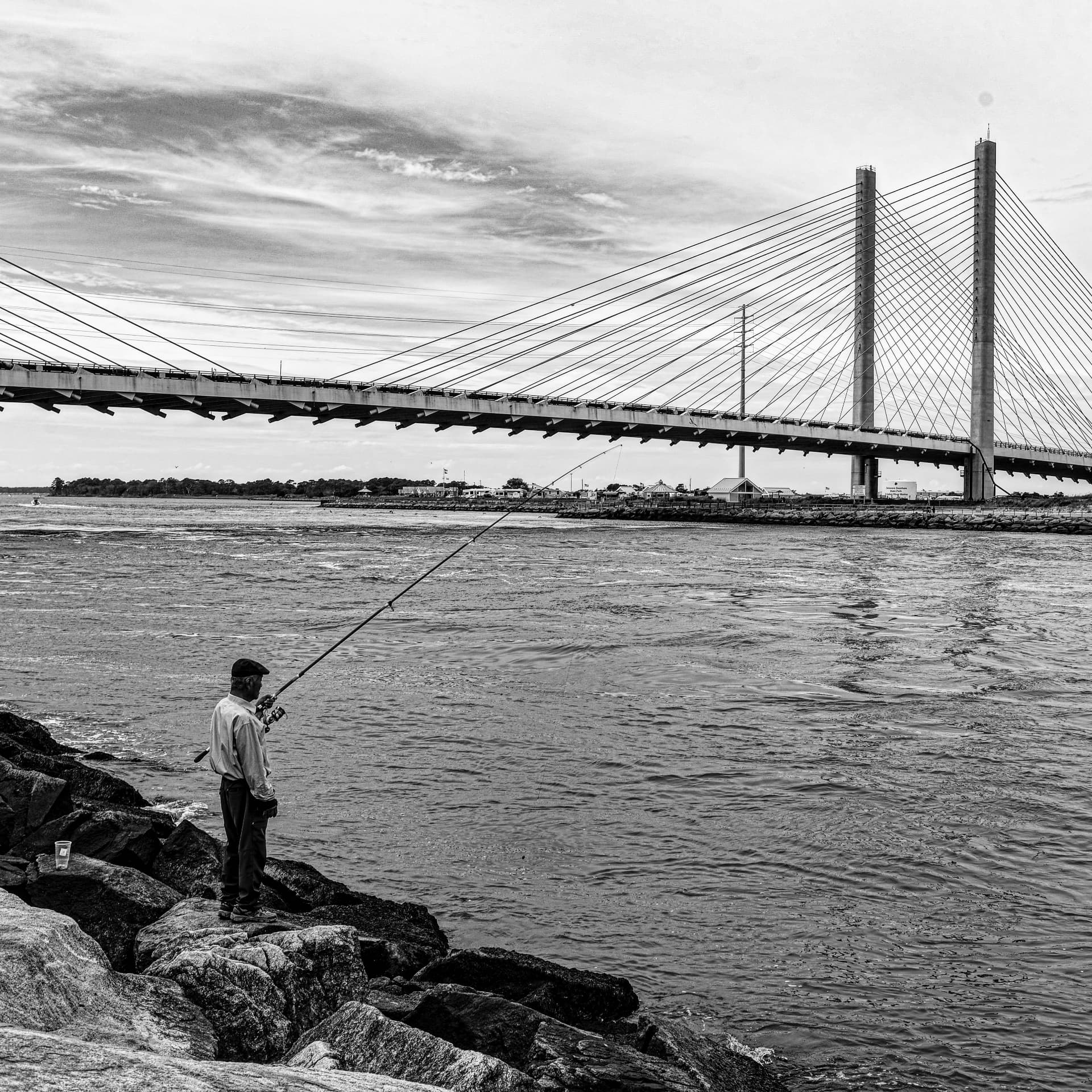 Casting a line under the bridge, Indian River Inlet, Delaware