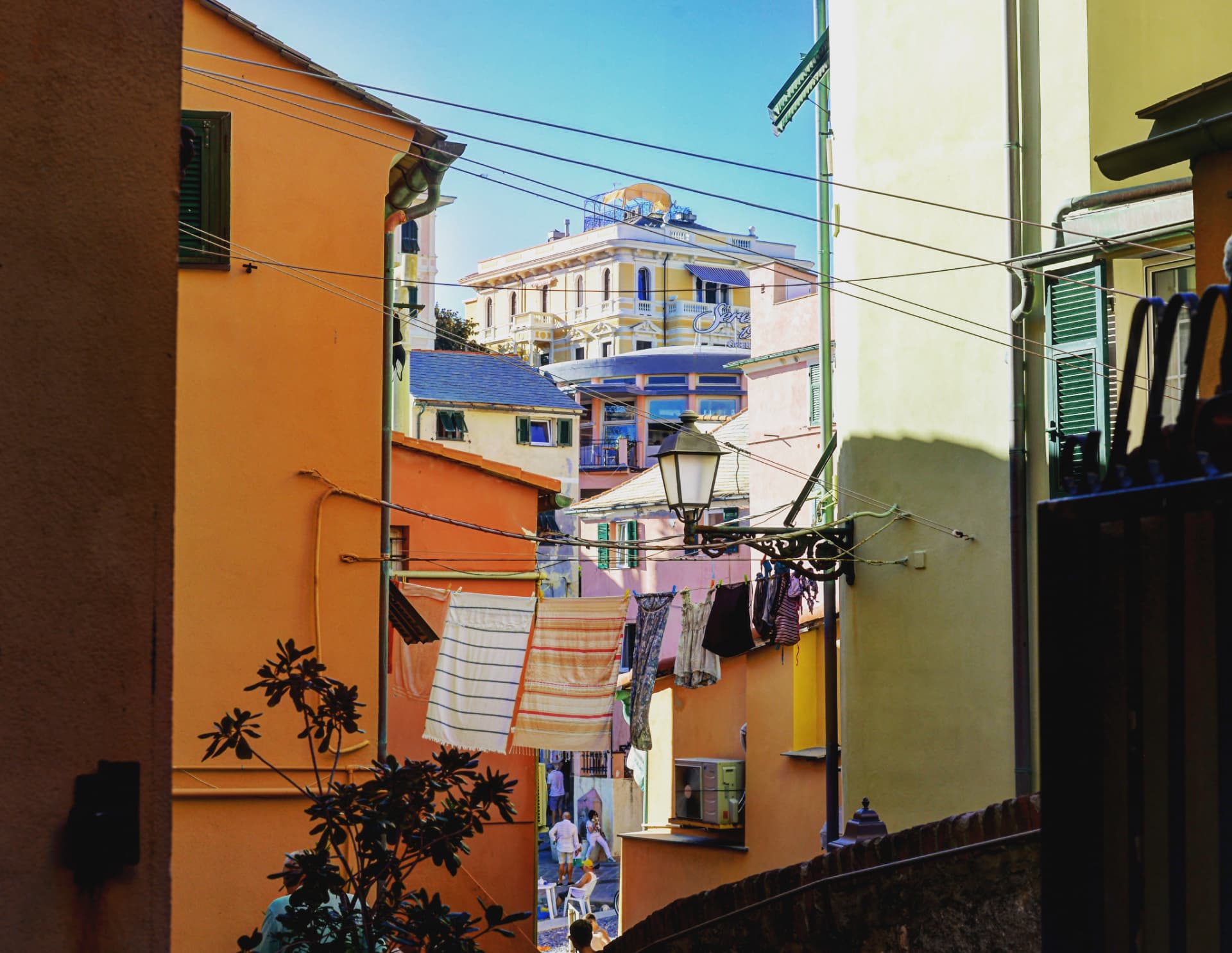 Laundry lines in a sunlit alley, Genoa, Italy